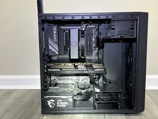 Inside a workstation build with tower cooler, graphics card and power supply